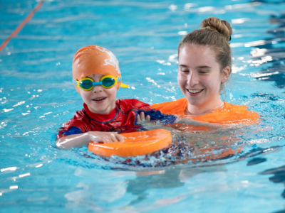 Cindy's Swim School boy swimming having fun toddler swim