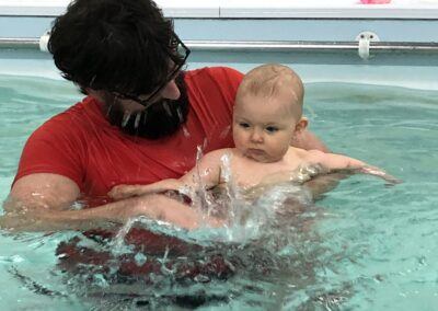 Baby splashing with Daddy